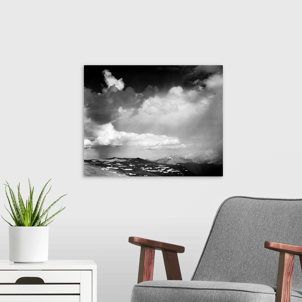 A modern room featuring In Rocky Mountain National Park, mountain tops, low horizon, dramatic clouded sky.