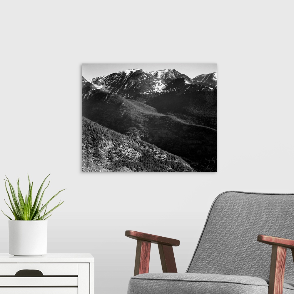 A modern room featuring In Rocky Mountain National Park, panorama of hills and mountains.