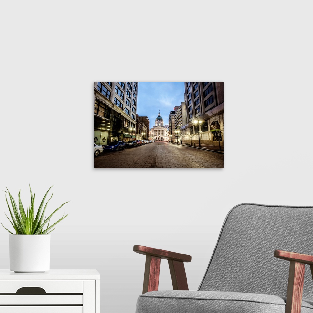 A modern room featuring Photo of the Indiana State House as the sun begins to rise.