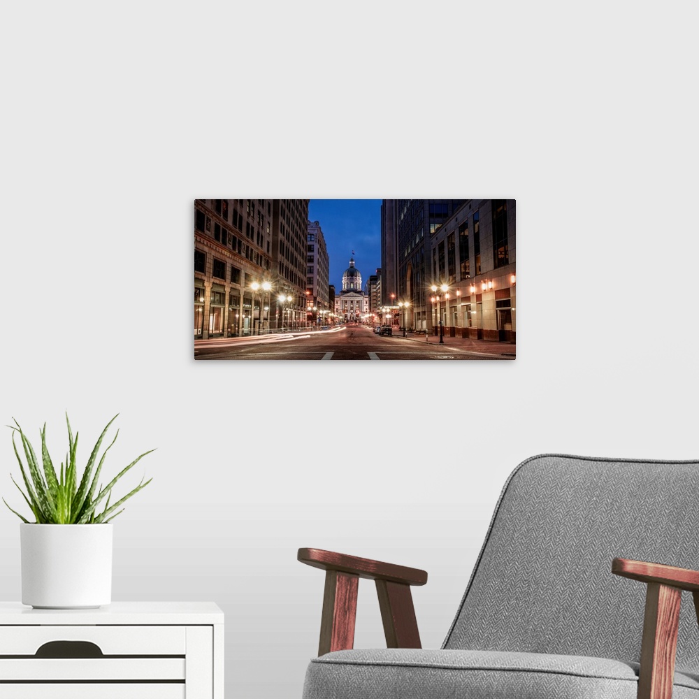 A modern room featuring Photo of the Indiana State House at night.