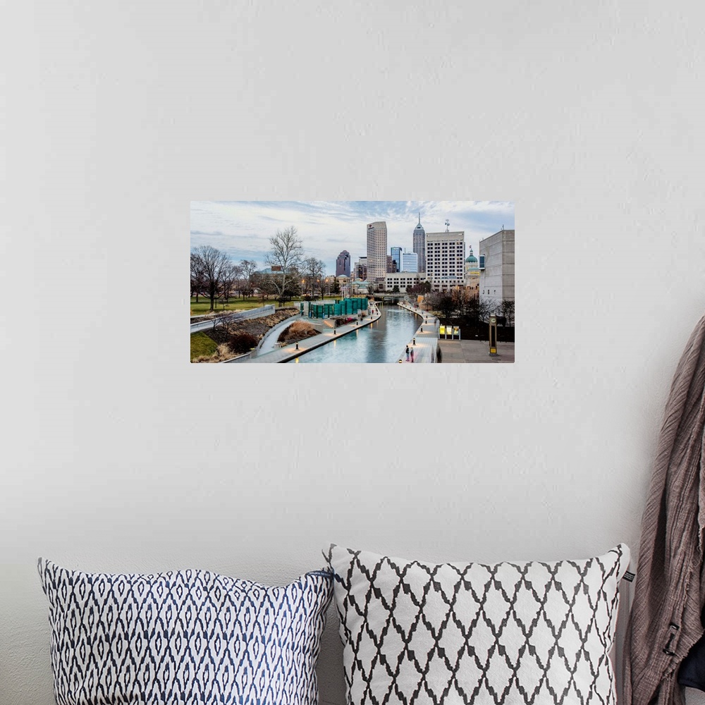 A bohemian room featuring Photo of the Indianapolis city skyline reflecting onto the Indiana Central Canal.