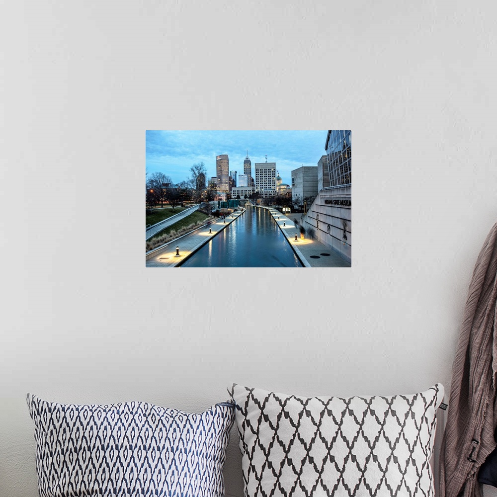 A bohemian room featuring Photo of the Indianapolis city skyline reflecting onto the Indiana Central Canal.