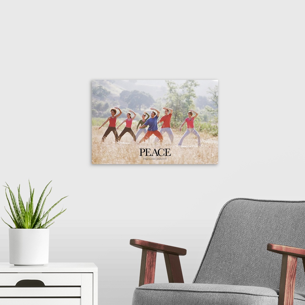 A modern room featuring Uplifting poster with a group of people doing yoga and meditation exercises in a grassy field wit...