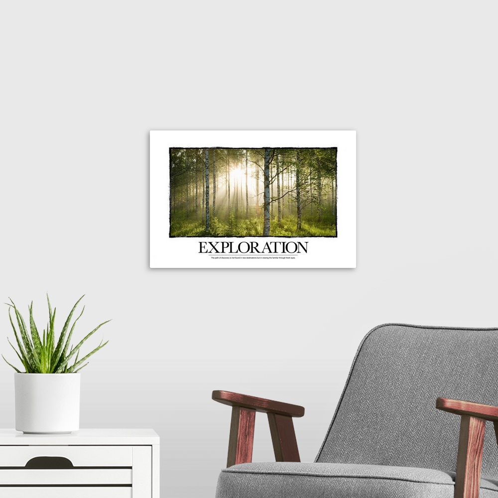 A modern room featuring Big canvas print of a forest with a blinding sun shining through and text at the bottom.