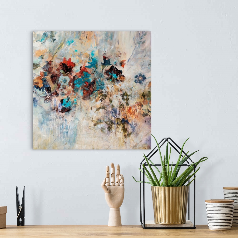 A bohemian room featuring Abstract art piece of flowers pushing through the textured cream background.