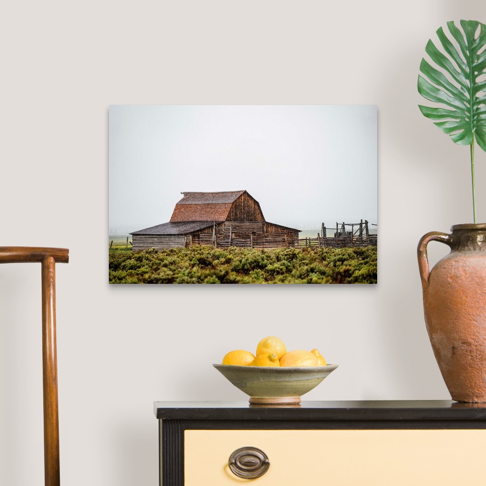 A traditional room featuring View of the John Moulton Barn with fog rolling in, Grand Teton National Park, Wyoming.