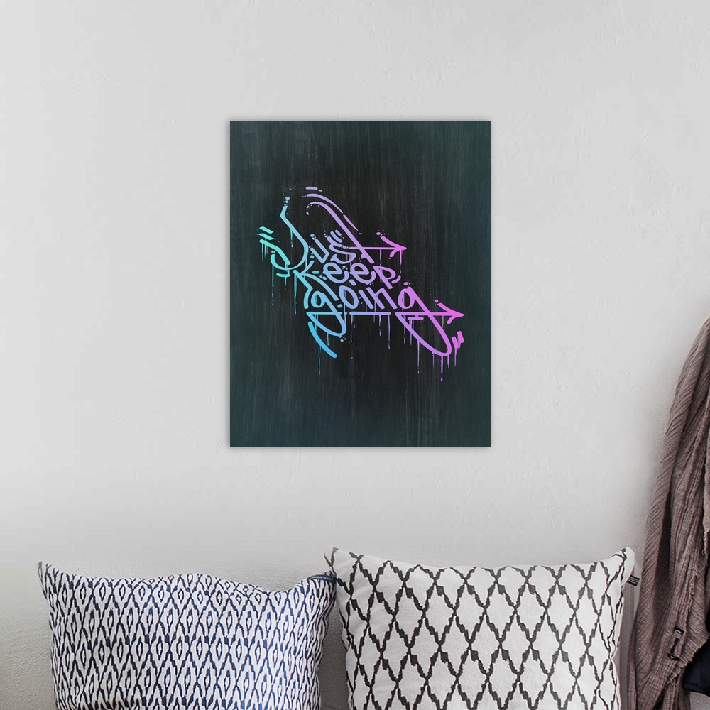 A bohemian room featuring Typography poster with dripping, graffiti-style text in a bright gradient.