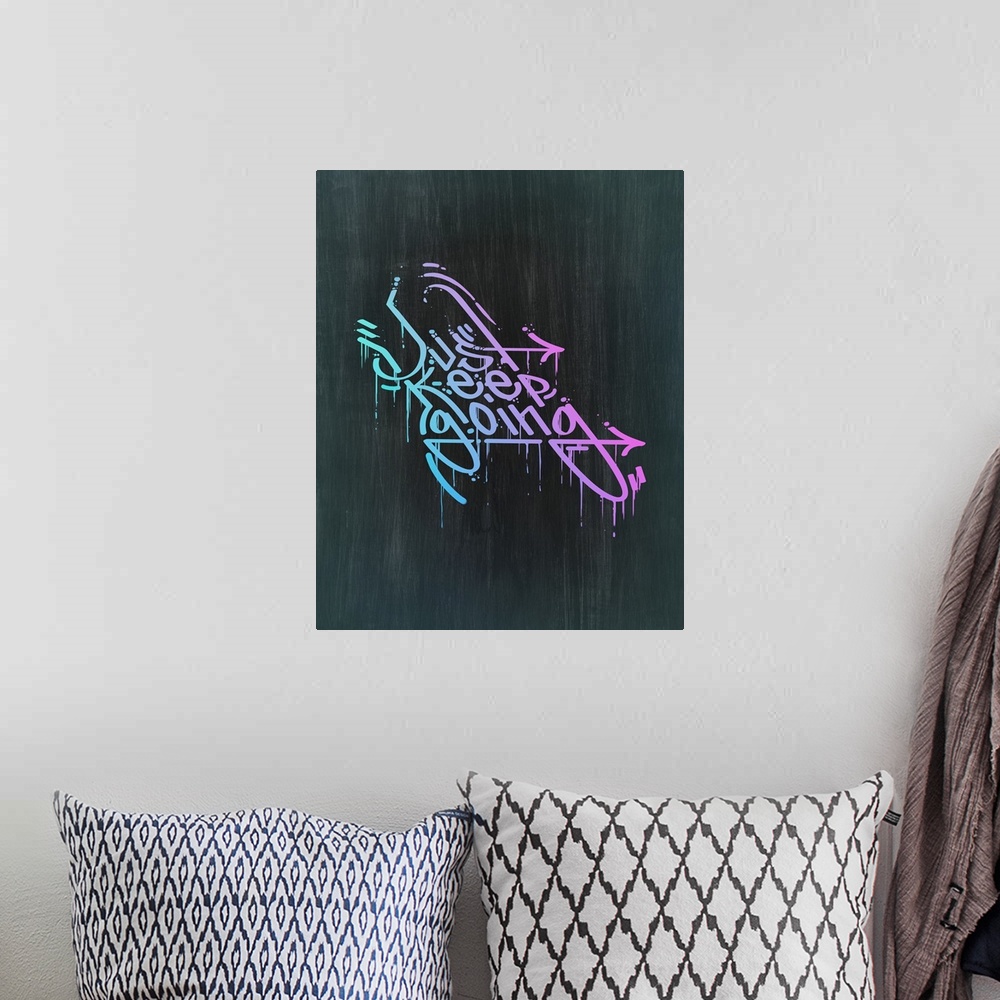 A bohemian room featuring Typography poster with dripping, graffiti-style text in a bright gradient.