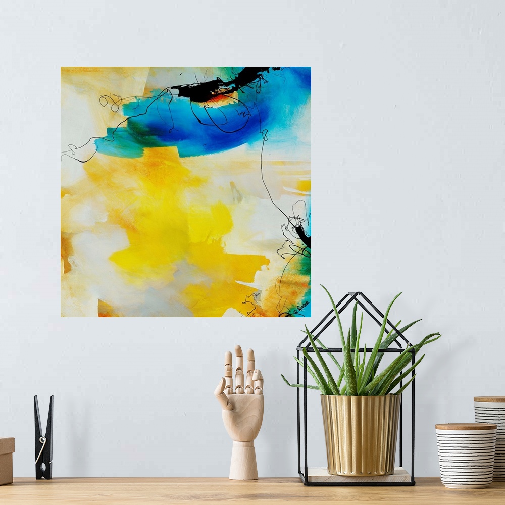 A bohemian room featuring Abstract painting of fluid black lines overtop of vibrant yellow and blue brushstrokes.