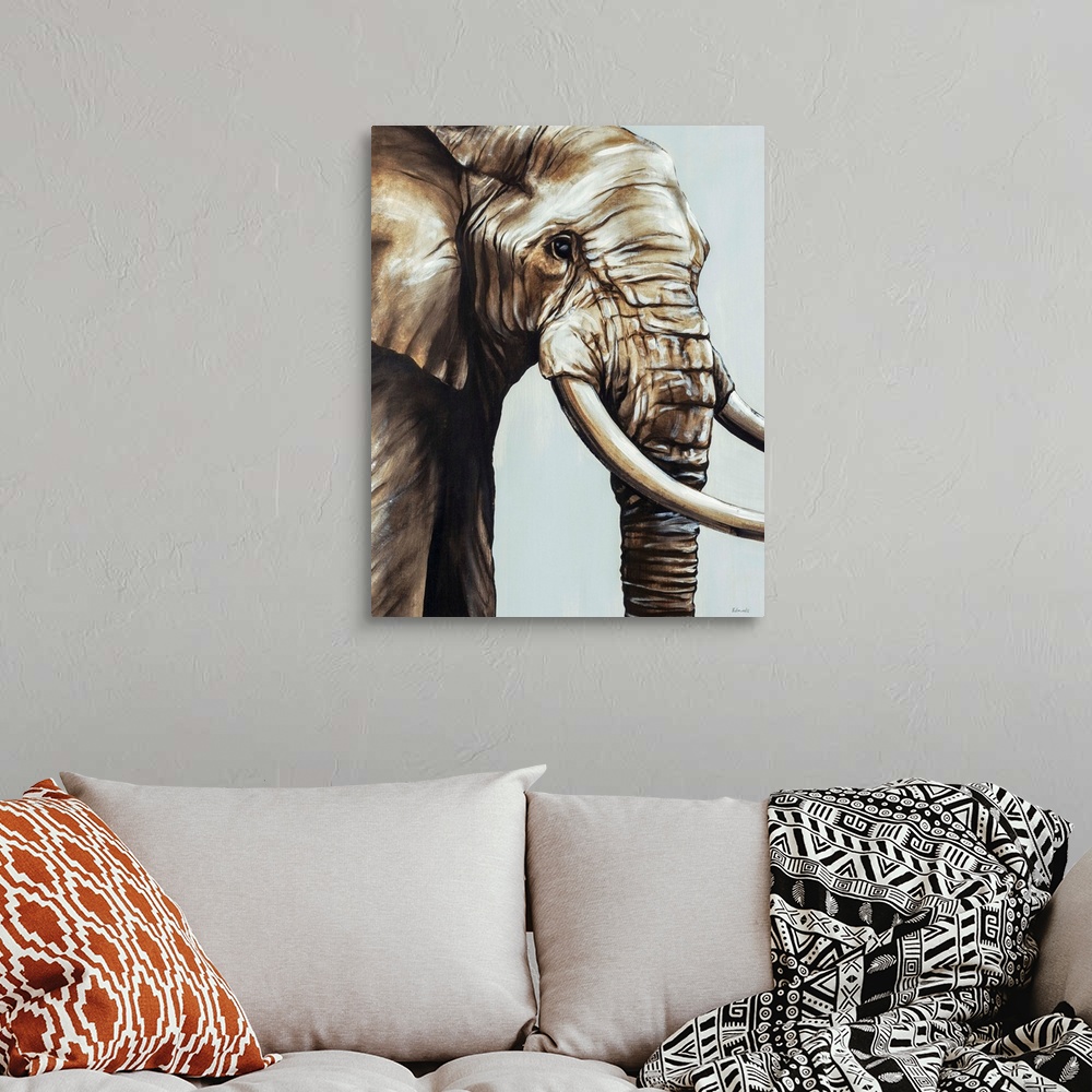 A bohemian room featuring Painted brown and gray portrait of an elephant.
