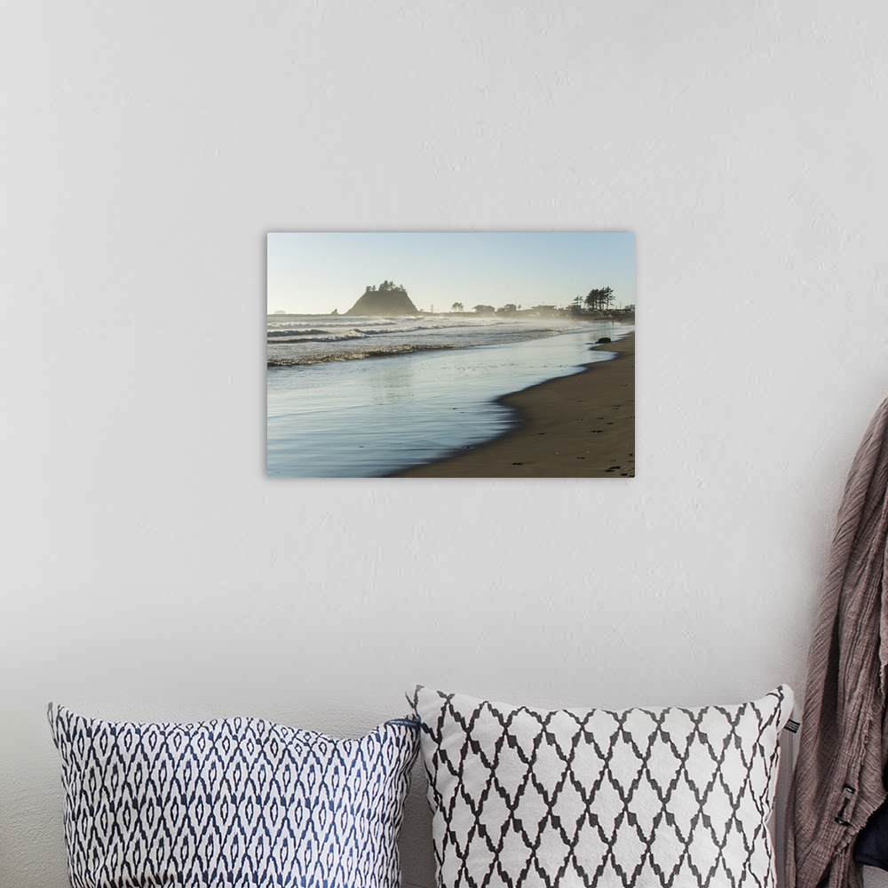 A bohemian room featuring Landscape photograph of the La Push Beach shore with misty rock cliffs in the background.