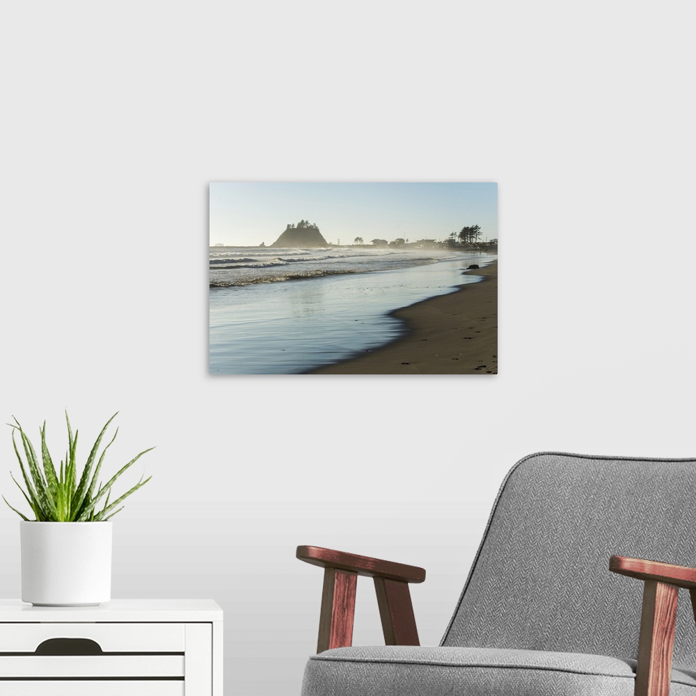 A modern room featuring Landscape photograph of the La Push Beach shore with misty rock cliffs in the background.