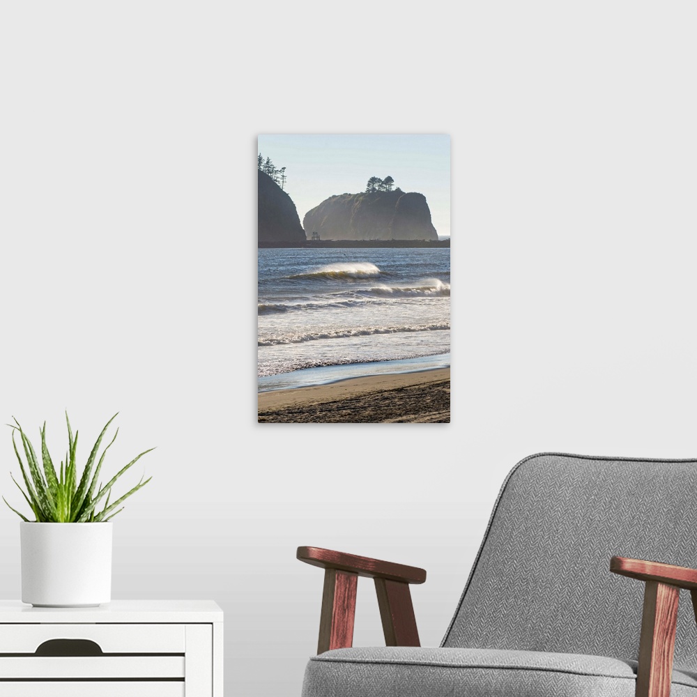A modern room featuring Landscape photograph of waves crashing on the shore in La Push, Washington, with rocky cliffs in ...