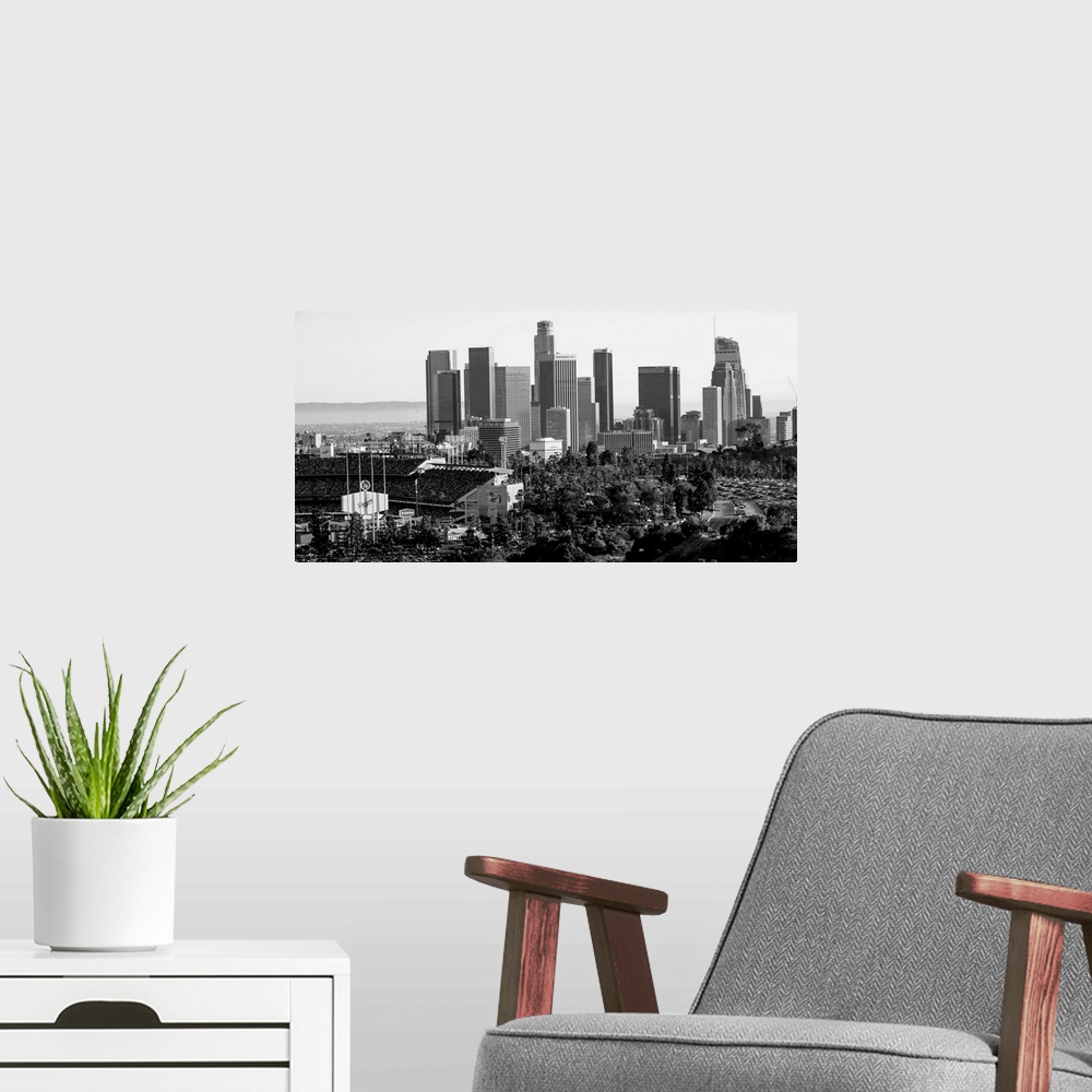 A modern room featuring Photograph of the downtown Los Angeles skyline with Dodger Stadium on the left.