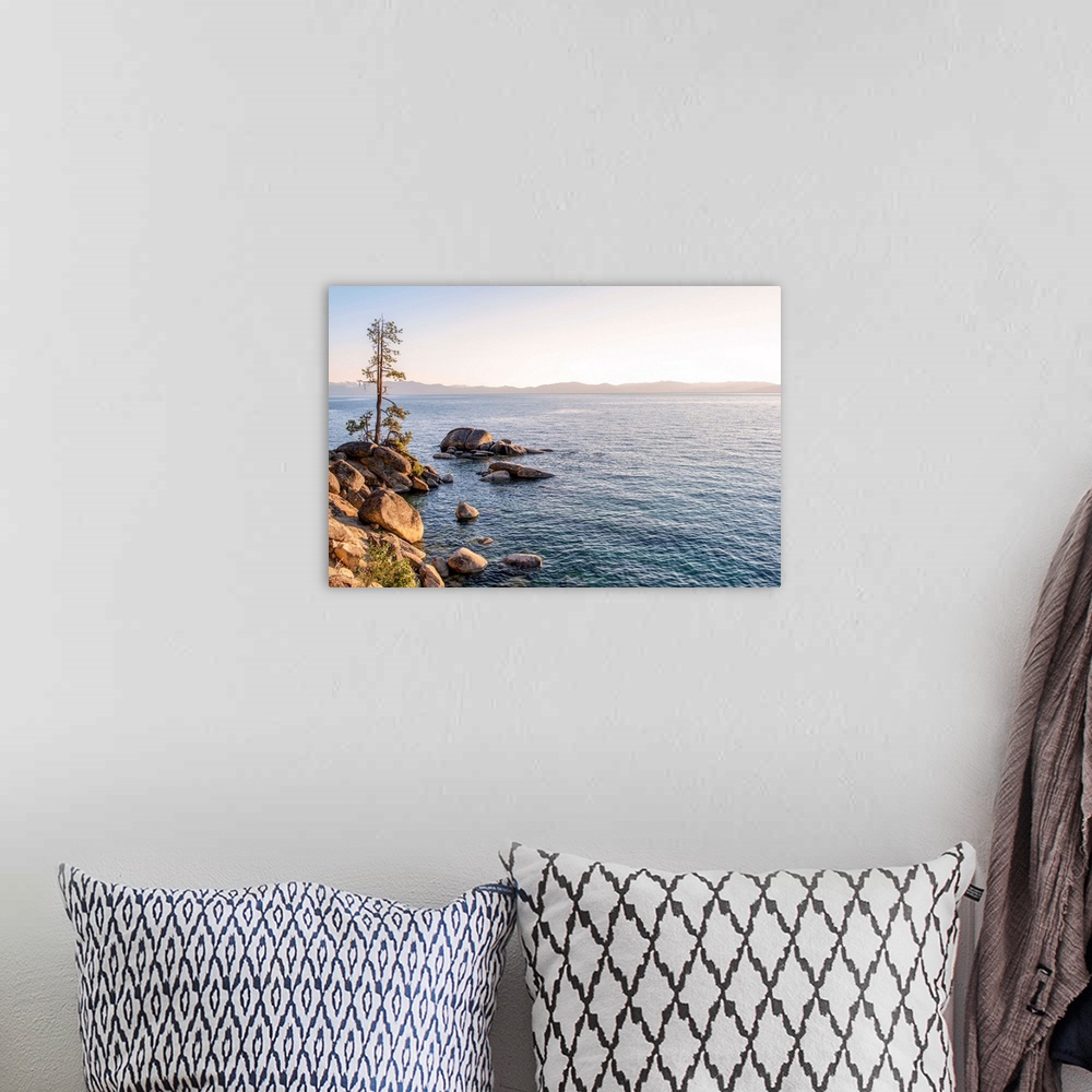 A bohemian room featuring View of Lake Tahoe's rocky shore with mountain landscape in the background in California and Nevada.
