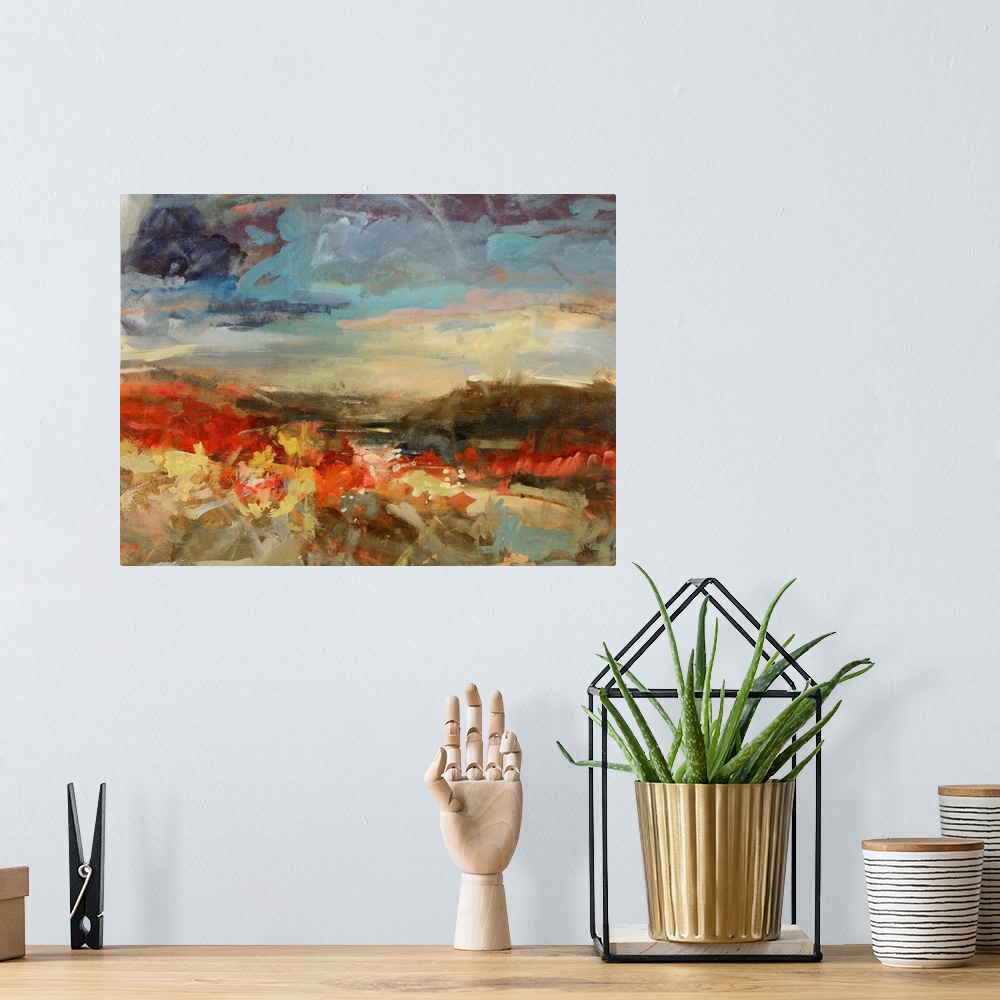 A bohemian room featuring A landscape painting of mountains a river with abstract styling.