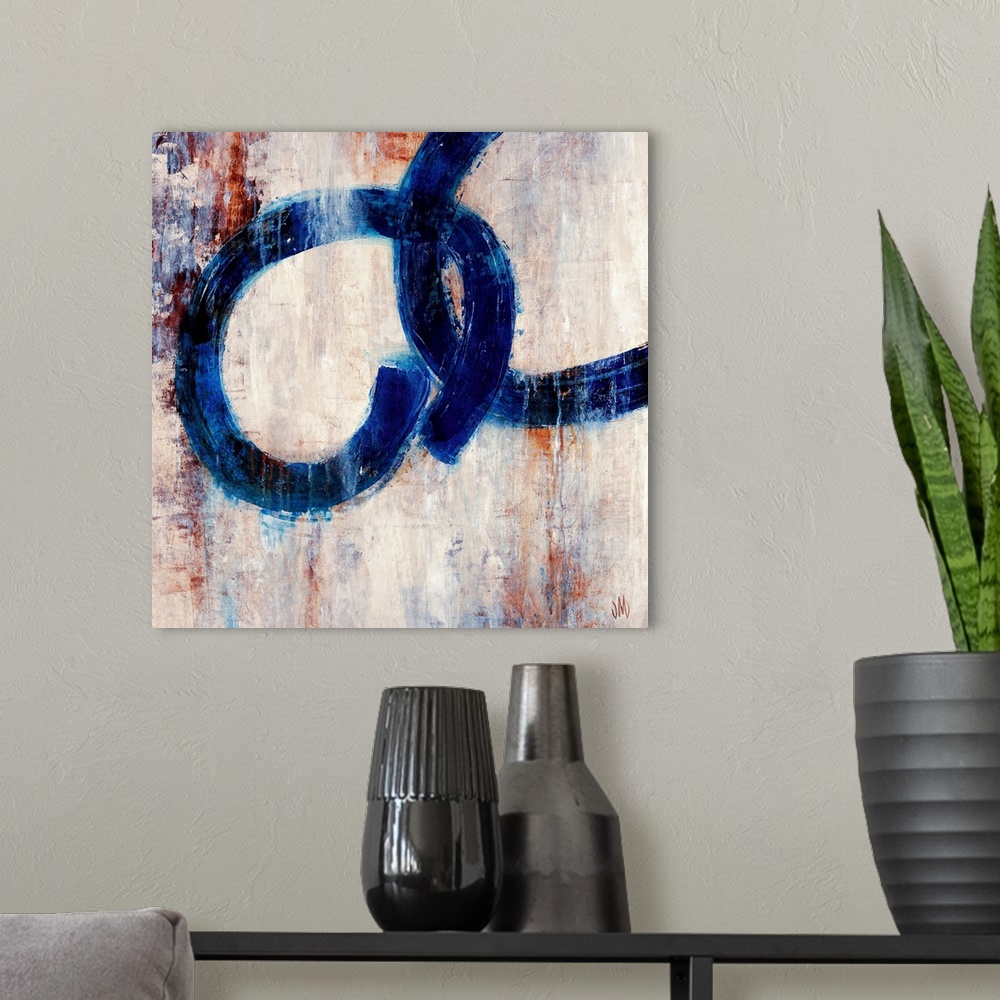 A modern room featuring Square, contemporary art on a large canvas of two dark rings interlocking, on a patchy background...