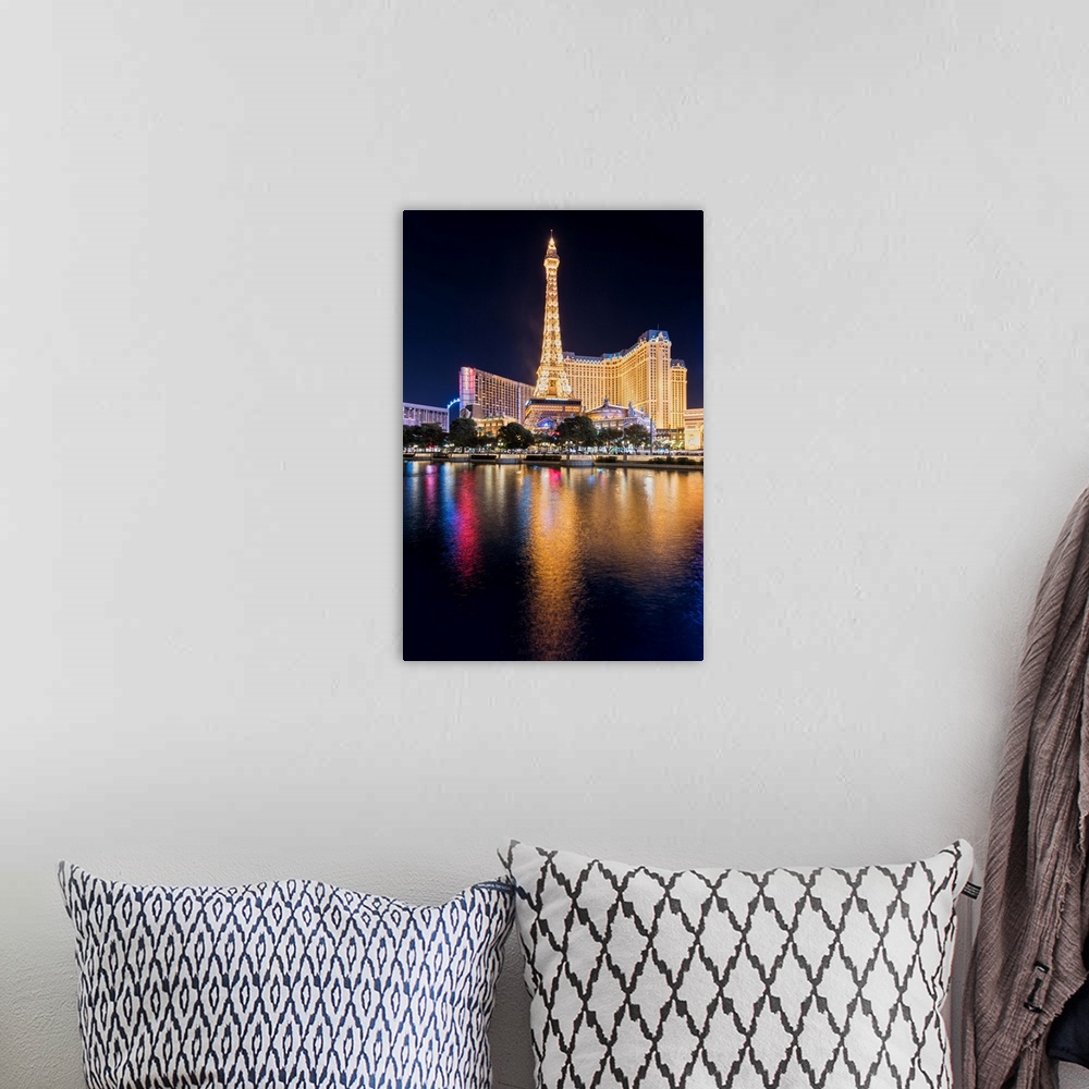 A bohemian room featuring Photograph of the Las Vegas strip lit up at night and reflecting into the water.