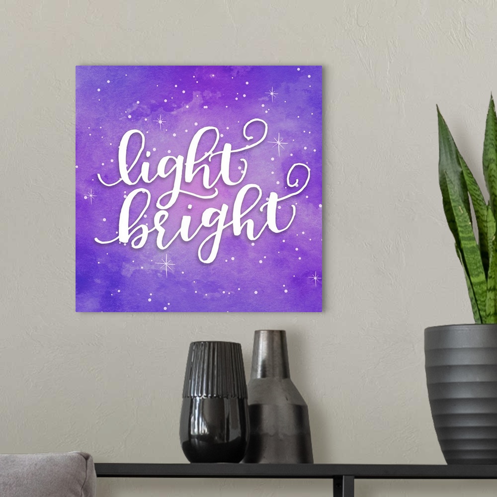 A modern room featuring Handlettered text reading "Light Bright" on a purple starry background.