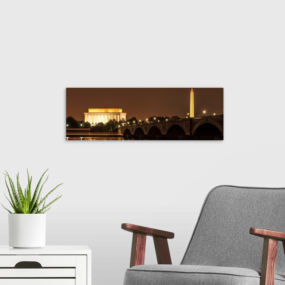 A modern room featuring Panoramic photograph of the Lincoln Memorial and Washington Monument lit up at night in Washingto...