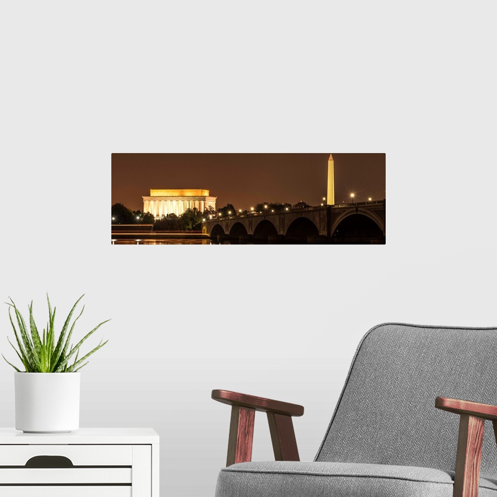 A modern room featuring Panoramic photograph of the Lincoln Memorial and Washington Monument lit up at night in Washingto...