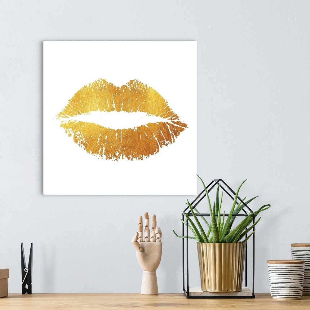 A bohemian room featuring A simple yet striking image of a lip print in a bright, vibrant gold tone.