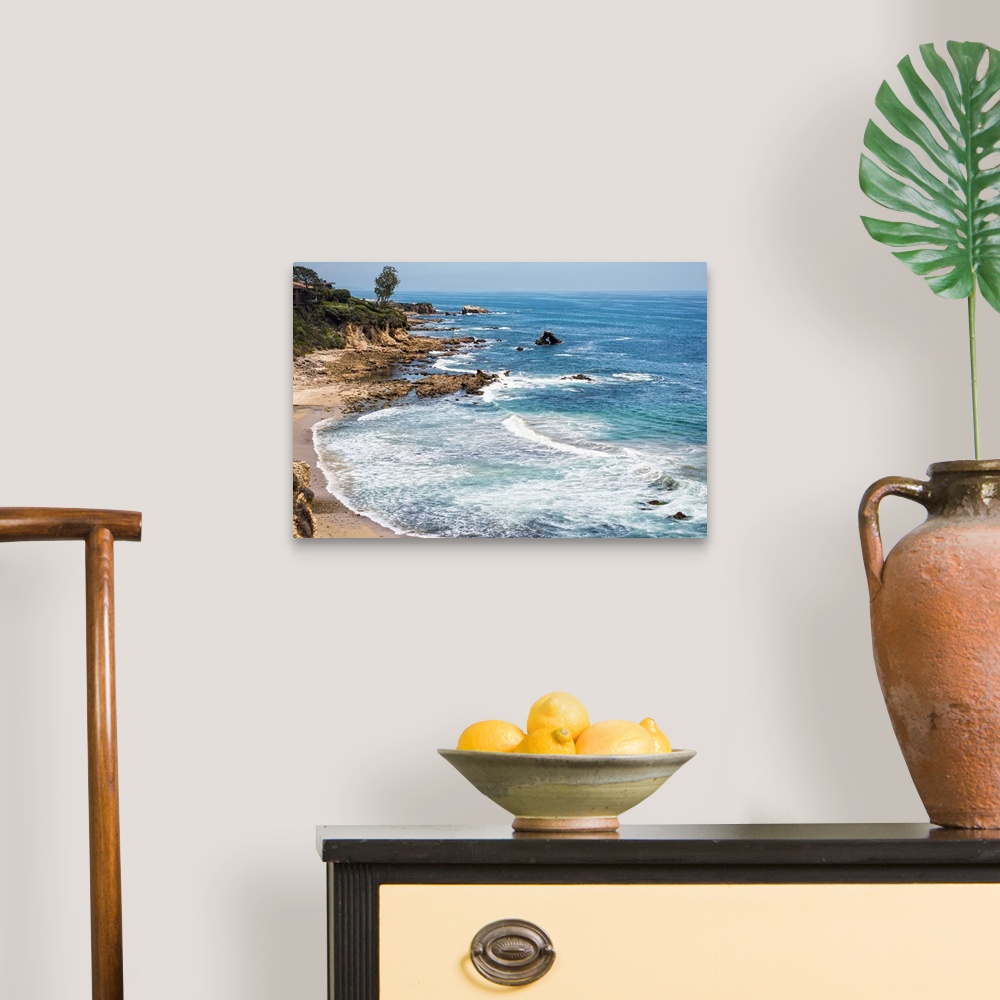 A traditional room featuring Little Corona del Mar beach is relatively small, flanked on both sides with rocky reefs.