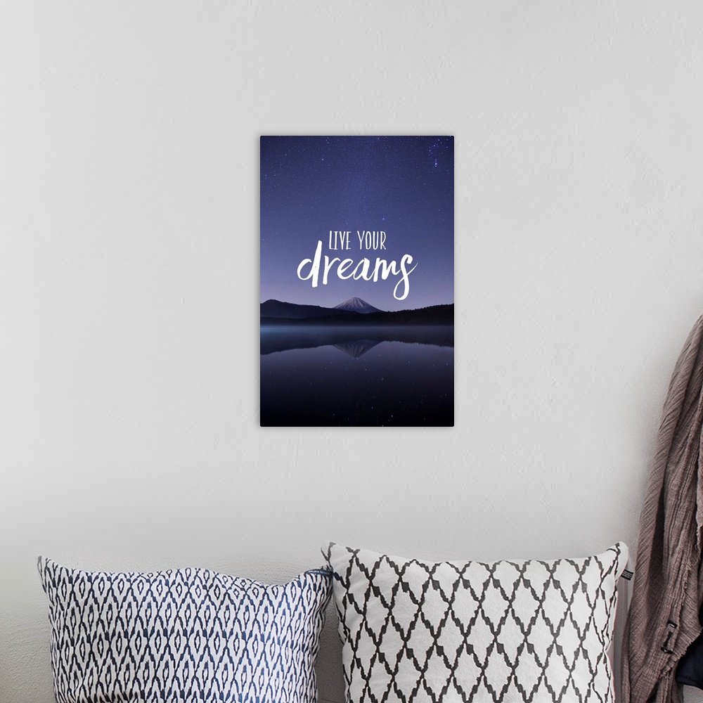 A bohemian room featuring Typography art against a photograph of a mountain under a night sky.