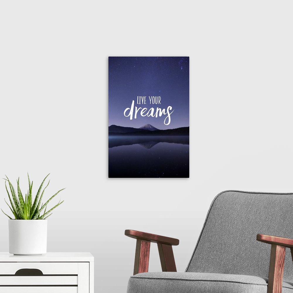 A modern room featuring Typography art against a photograph of a mountain under a night sky.