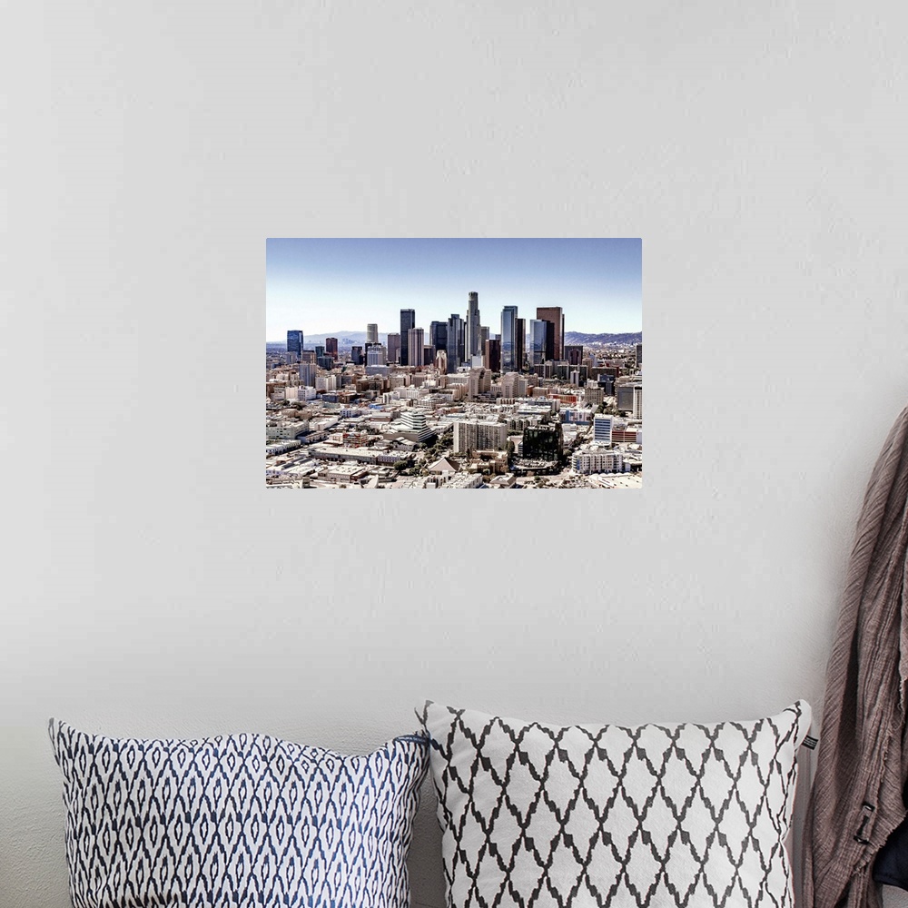 A bohemian room featuring Skyscrapers and surrounding buildings of the Los Angeles skyline under a blue sky, California.