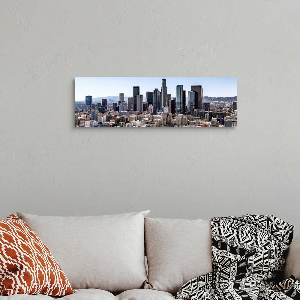 A bohemian room featuring Panoramic photograph of skyscrapers and surrounding buildings of the Los Angeles skyline under a ...