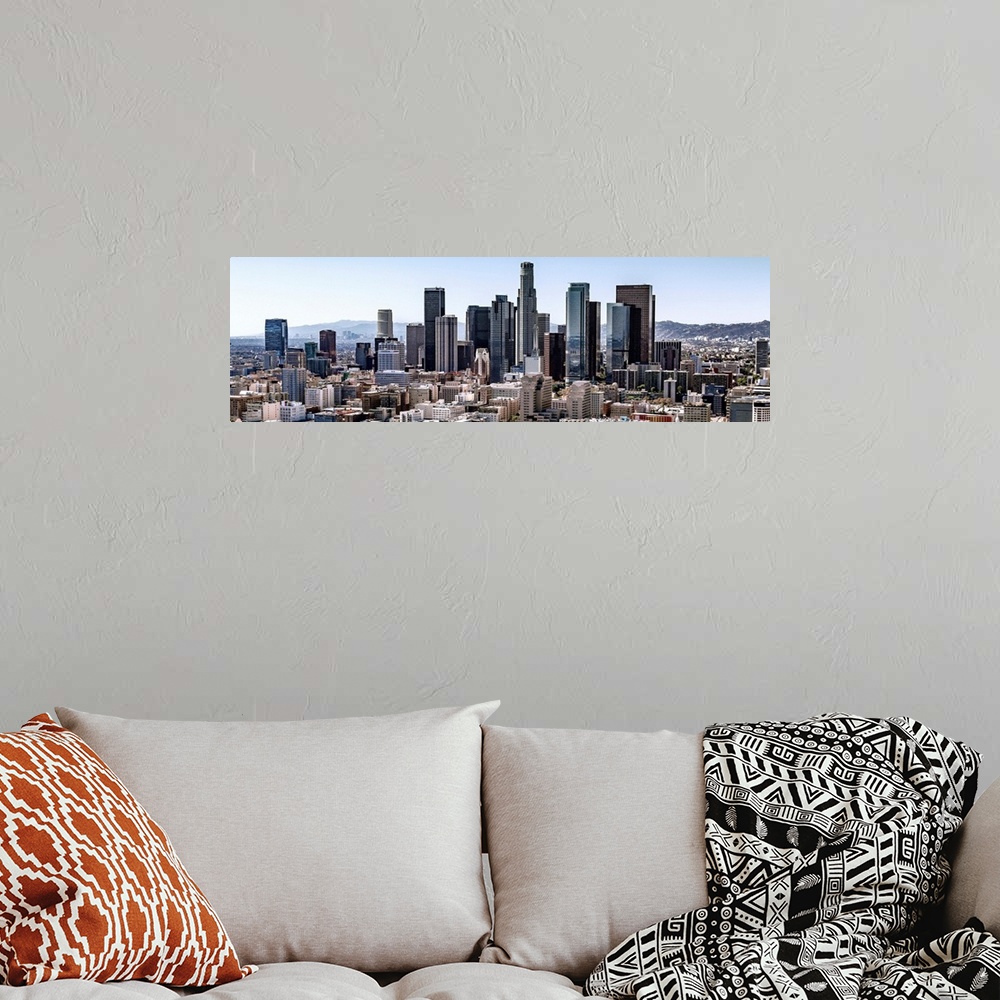 A bohemian room featuring Panoramic photograph of skyscrapers and surrounding buildings of the Los Angeles skyline under a ...