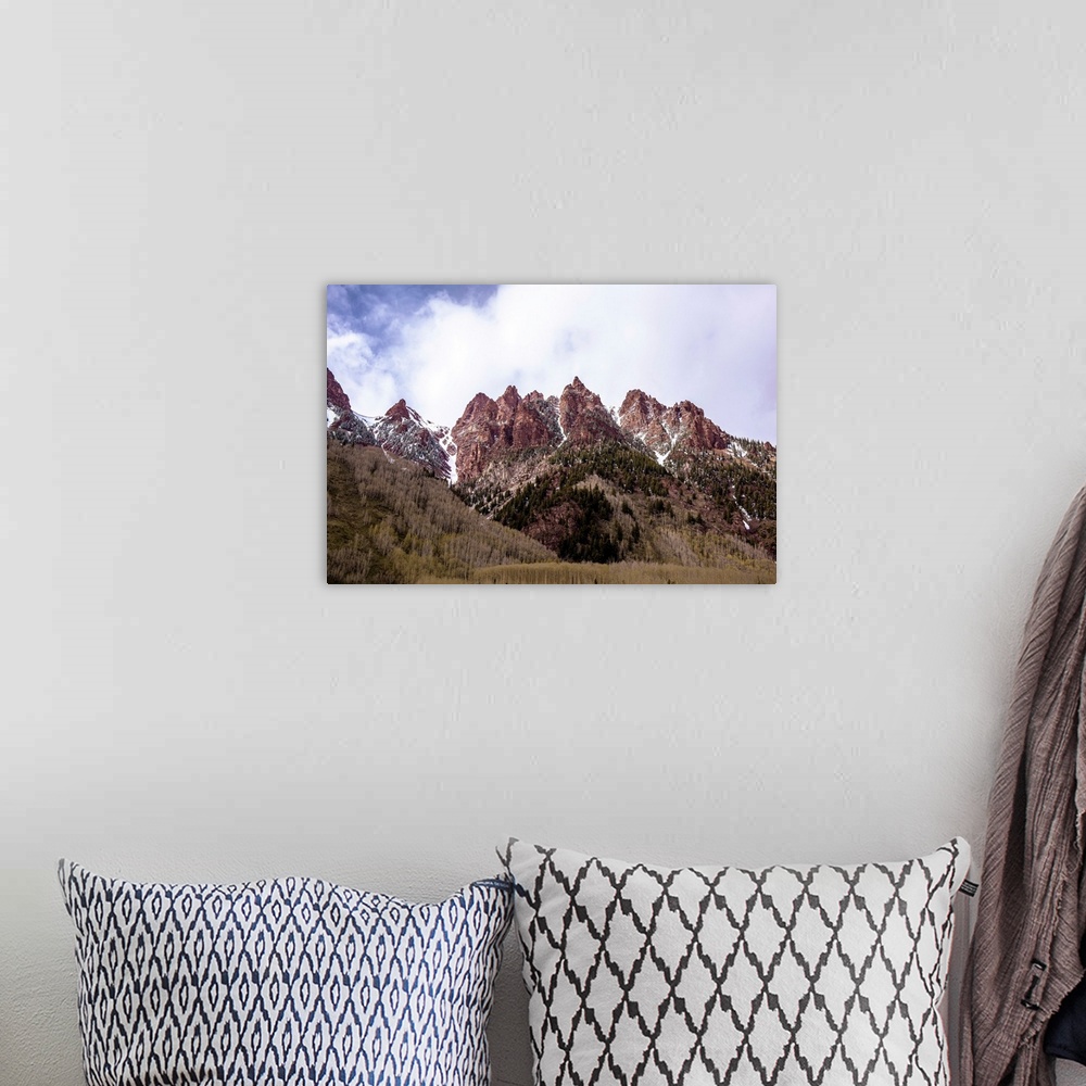 A bohemian room featuring Photo of majestic mountain peaks with fragments of snow in Colorado.