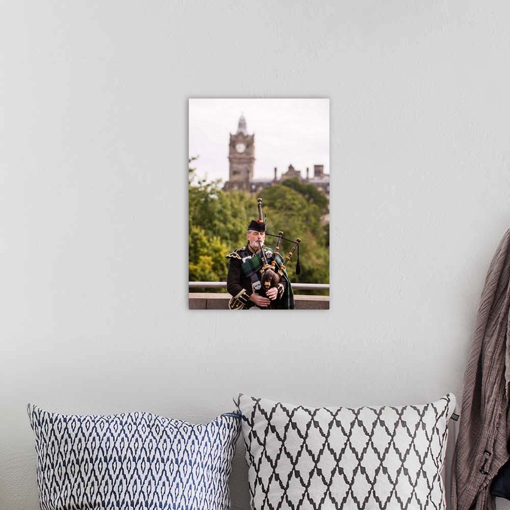 A bohemian room featuring Photograph of a man playing the bagpipes in Edinburgh with the clock tower blurred out in the bac...
