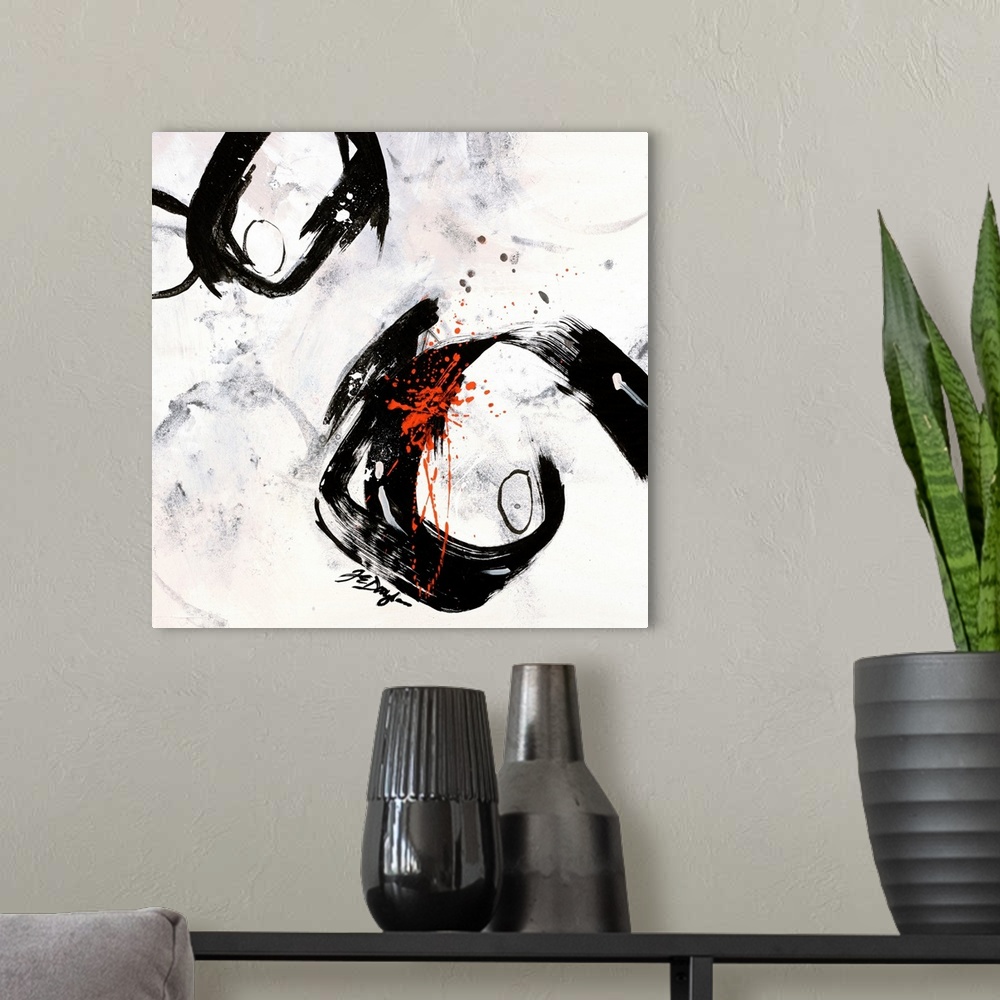 A modern room featuring Contemporary abstract painting of two boldly colored circles surrounded by paint smudges and cove...