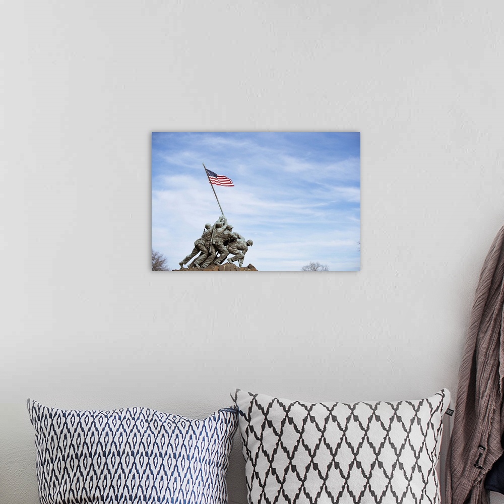 A bohemian room featuring The Iwo Jima Memorial Statue against a blue sky in Washington, DC.