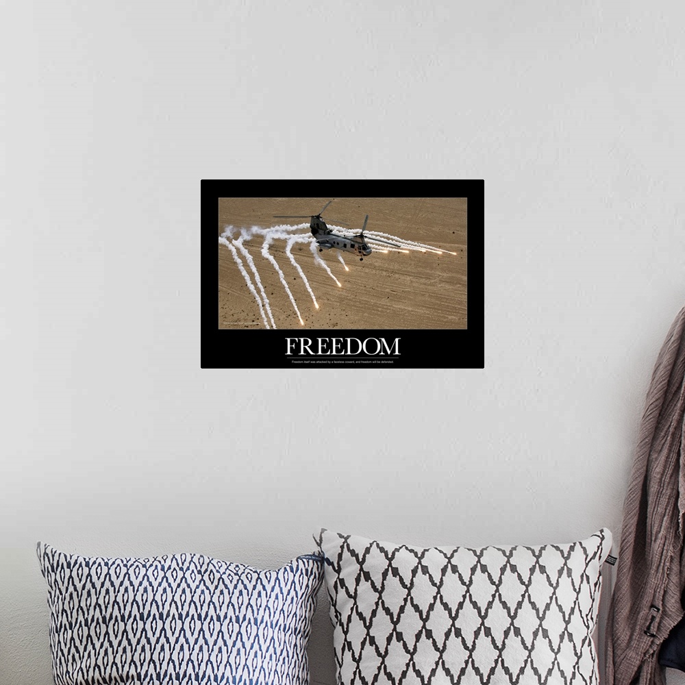 A bohemian room featuring A military helicopter is pictured as it shoots numerous flares above the desert. The word freedom...