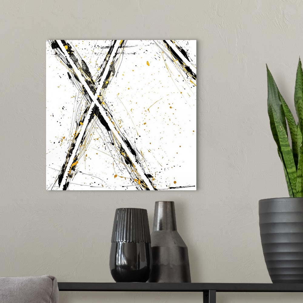 A modern room featuring Abstract contemporary art forming an 'x' shape with black and yellow streaks.