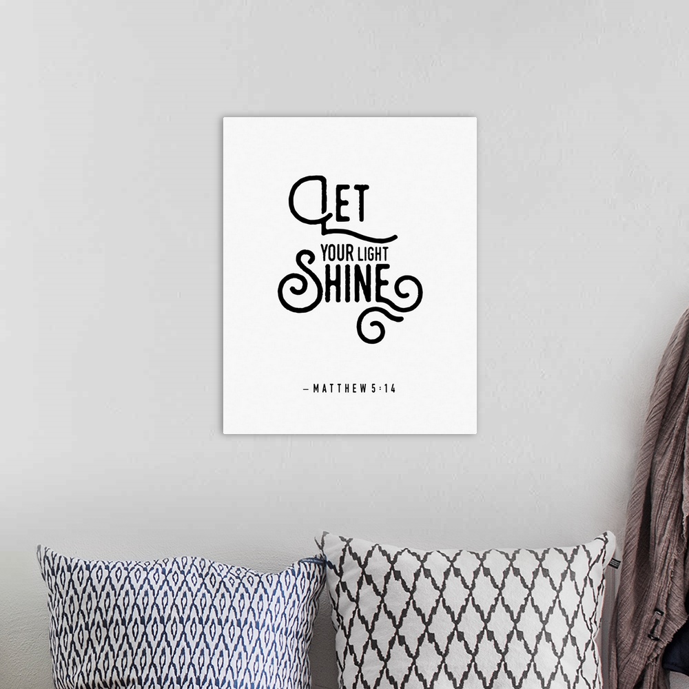 A bohemian room featuring Handlettered Bible verse reading Let your light shine.