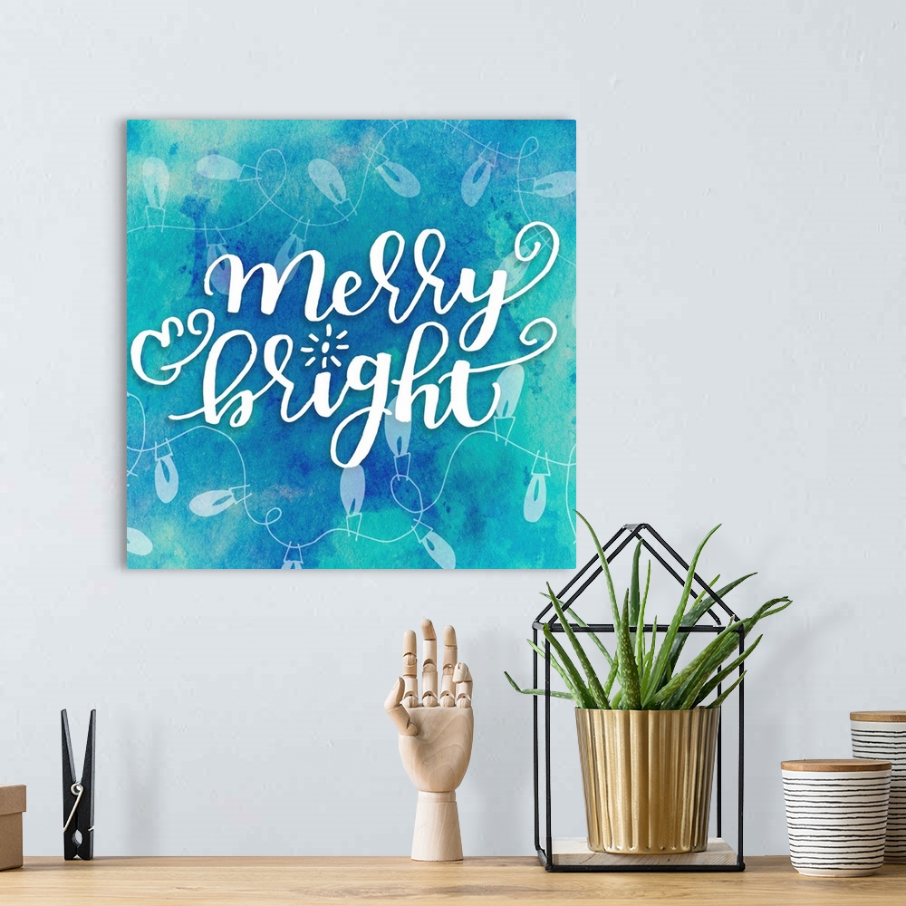 A bohemian room featuring Handlettered text reading "Merry and Bright" on a blue background with Christmas lights.