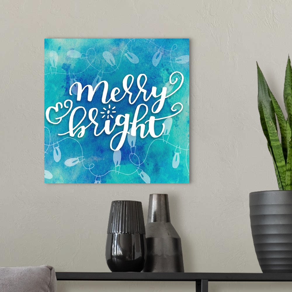 A modern room featuring Handlettered text reading "Merry and Bright" on a blue background with Christmas lights.