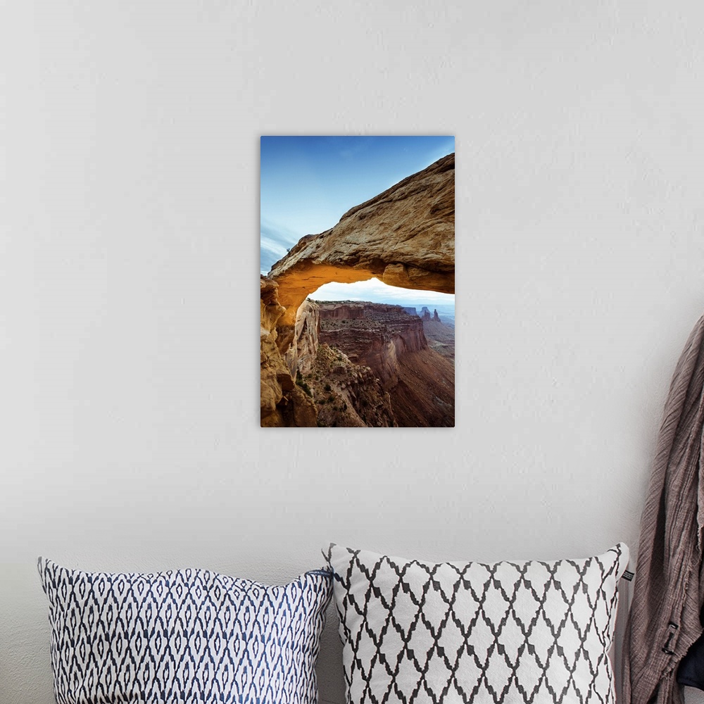A bohemian room featuring Photograph of the Mesa Arch with canyons in the background in Arches National Park, Utah.