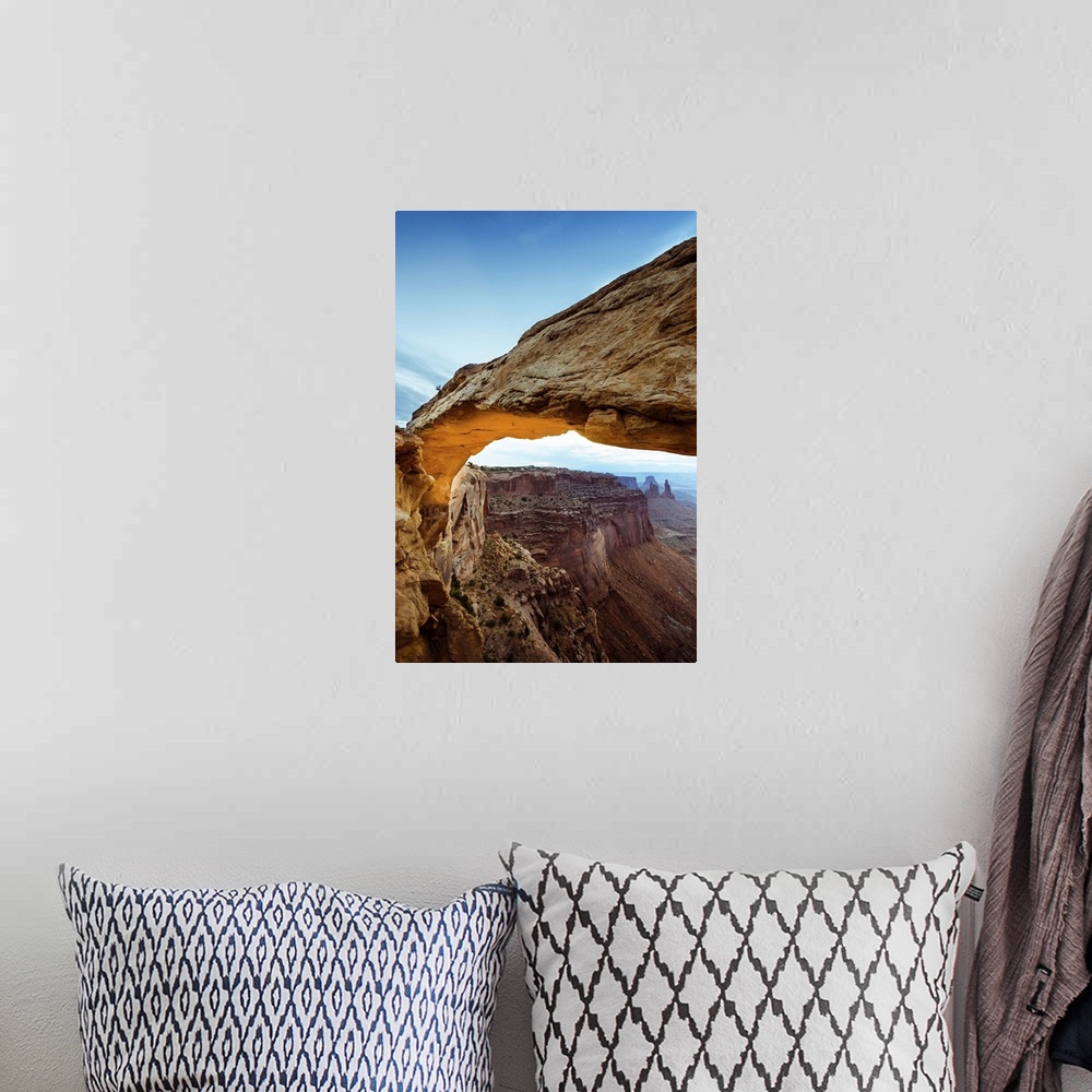 A bohemian room featuring Photograph of the Mesa Arch with canyons in the background in Arches National Park, Utah.