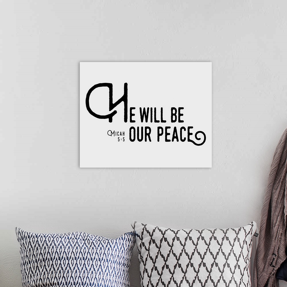A bohemian room featuring Handlettered Bible verse reading He will be our peace.