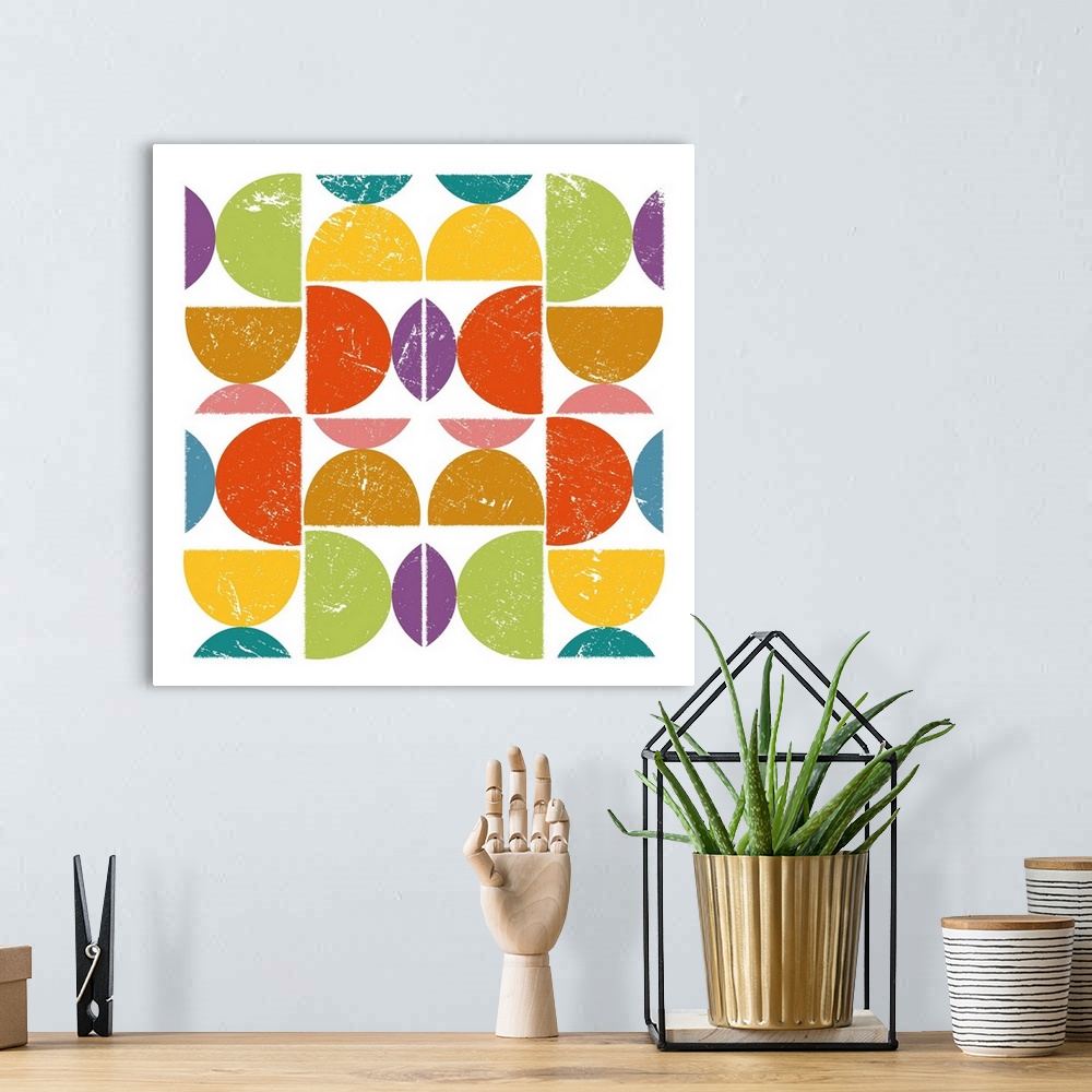 A bohemian room featuring Square illustration of of bright colored semi-circles in a square design.