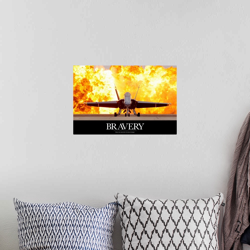 A bohemian room featuring Military poster of a picture taken straight on of an aircraft that has a fiery explosion behind i...