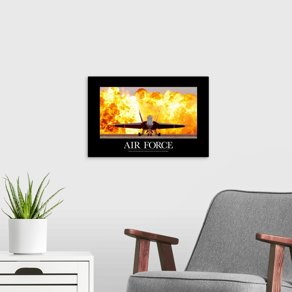 A modern room featuring Military Poster: An F/A-18 Hornet sits on the flight line with a wall of fire behind it