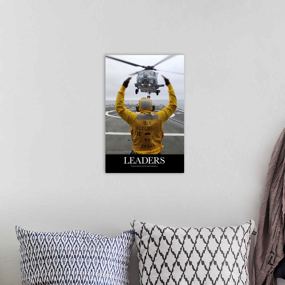 A bohemian room featuring Military Poster: Petty Officer guides an SH-60R Sea Hawk helicopter