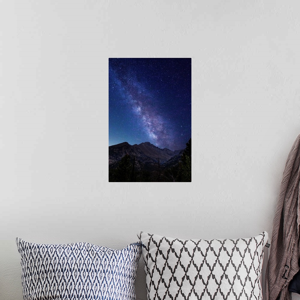 A bohemian room featuring Photograph of the milky way over the Rocky Mountains in Rocky Mountain National Park.