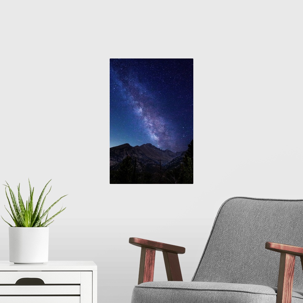 A modern room featuring Photograph of the milky way over the Rocky Mountains in Rocky Mountain National Park.